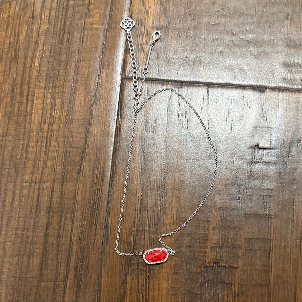 Silver Kendra Scott necklace with ruby gem